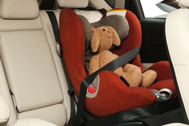 Photo of Safety seat for baby with cute toy rabbit