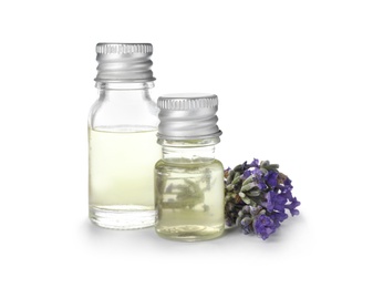 Photo of Bottles with natural lavender oil and flowers on white background