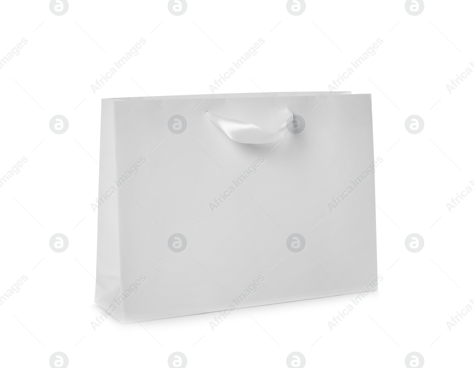 Photo of Paper shopping bag isolated on white. Mock up for design