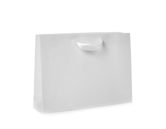 Photo of Paper shopping bag isolated on white. Mock up for design