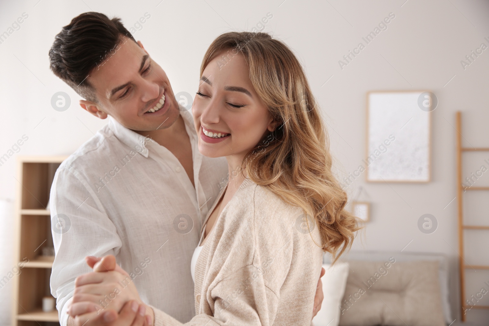 Photo of Lovely couple enjoying time together at home