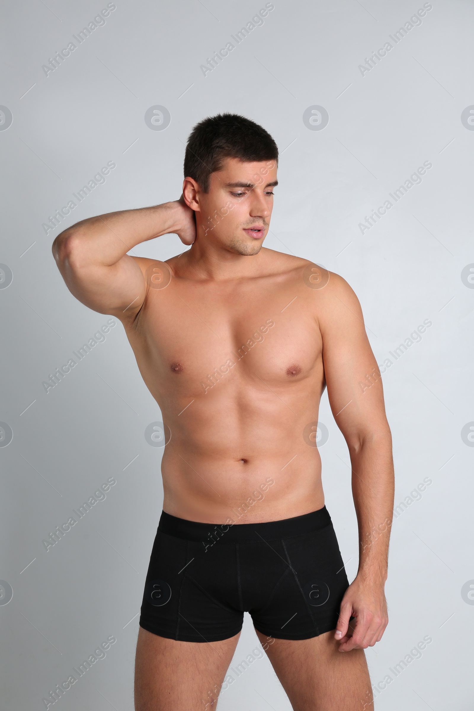 Photo of Man with sexy body on light background