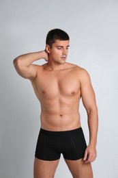 Man with sexy body on light background