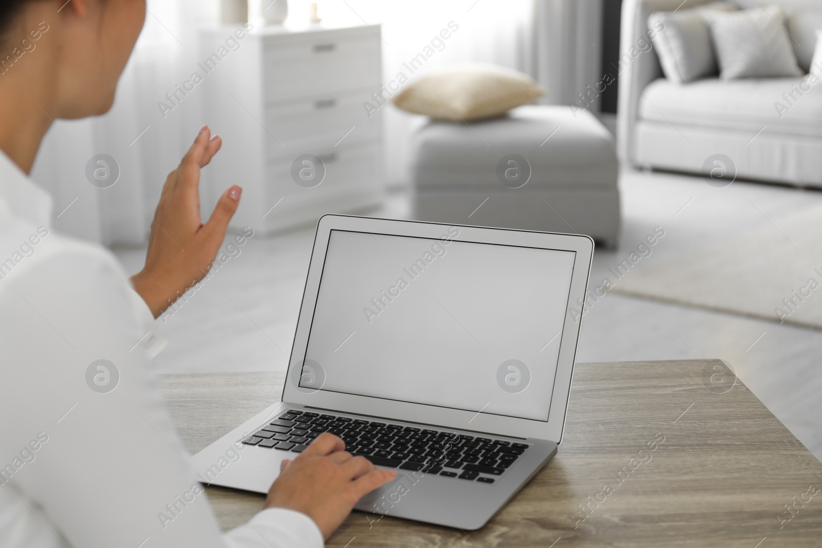 Photo of Coworkers working together online. Young woman using video chat on laptop, closeup