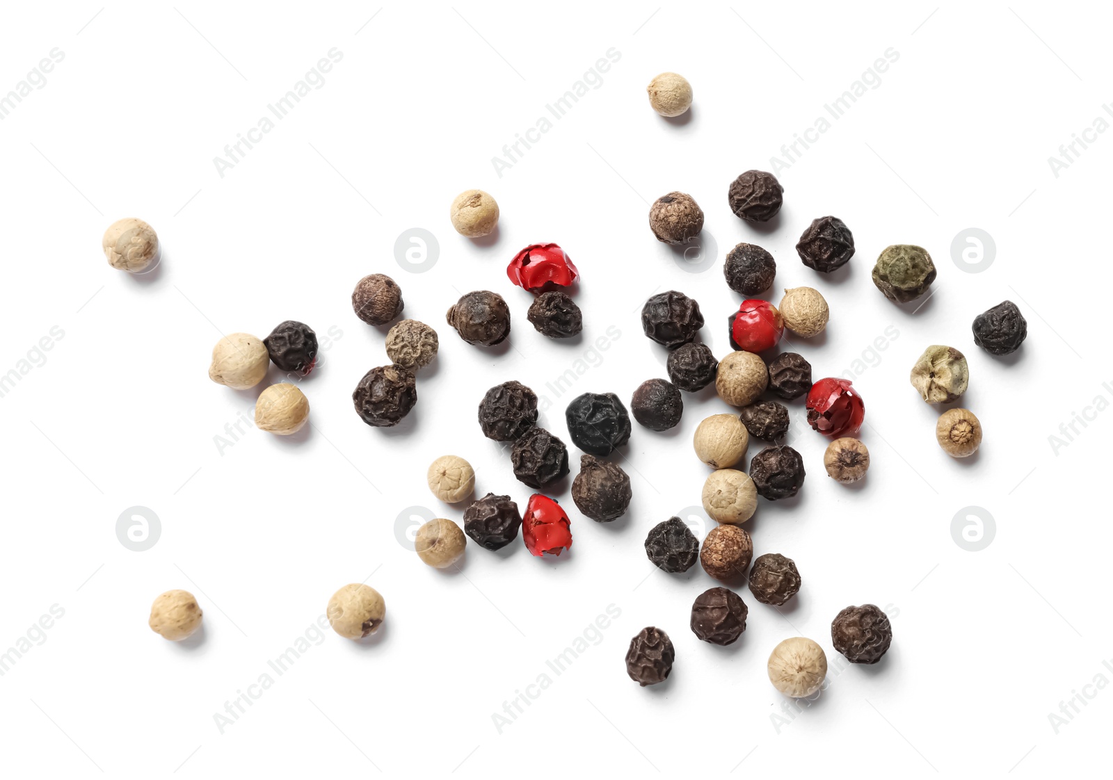 Photo of Aromatic spices. Pile of different peppers isolated on white, top view