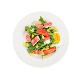 Plate with delicious crab stick salad isolated on white, top view