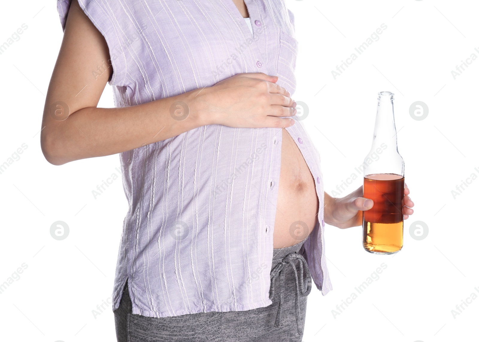 Photo of Pregnant woman with bottle of whiskey on white background. Alcohol addiction