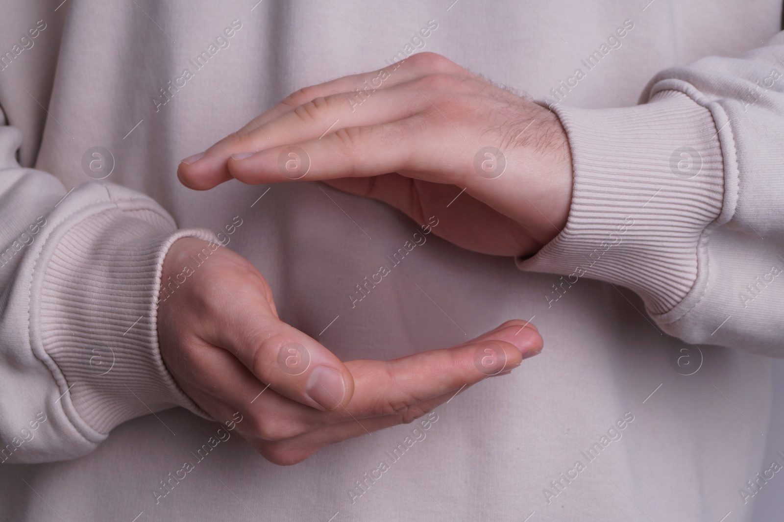 Photo of Female health. Closeup view of man's hands