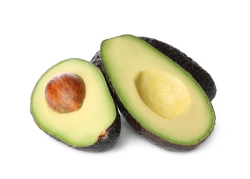 Photo of Cut and whole ripe avocadoes on white background