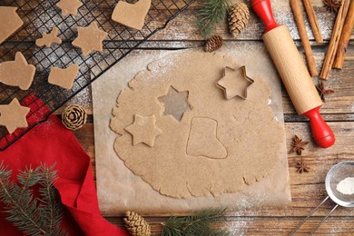 Homemade Christmas cookies. Flat lay composition with dough on wooden table