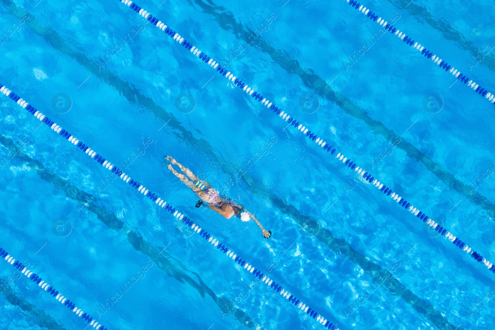 Image of Woman training in swimming pool, top view