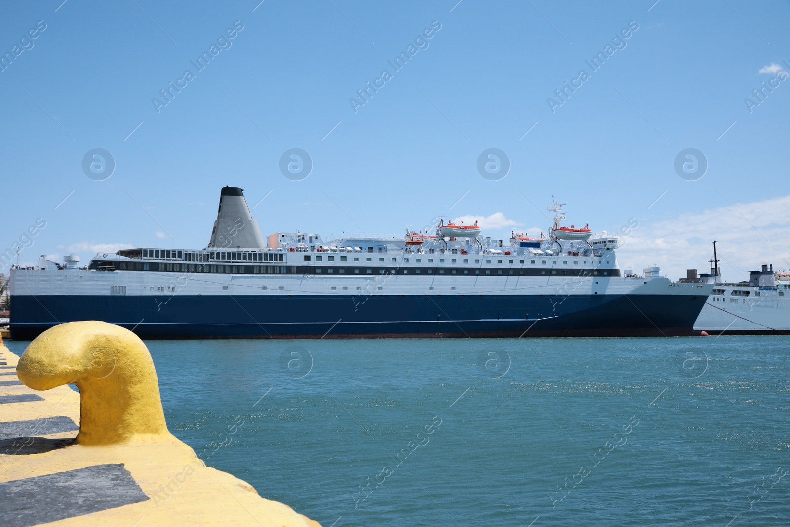 Photo of Modern ferry in sea port on sunny day