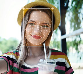 Facial recognition system. Woman with scanner frame and digital biometric grid, outdoors