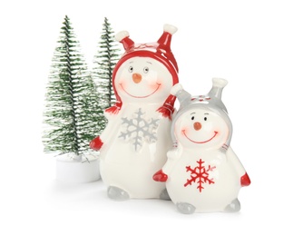 Photo of Decorative snowmen and Christmas trees on white background