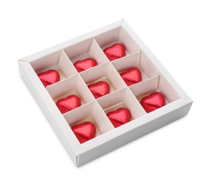 Photo of Heart shaped chocolate candies in box on white background