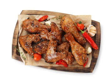 Photo of Tasty chicken glazed in soy sauce and different products isolated on white, top view