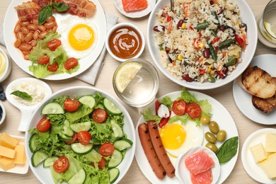 Photo of Different delicious dishes on table, flat lay. Buffet service