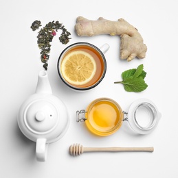 Photo of Composition with lemon tea, honey and ginger on white background, top view