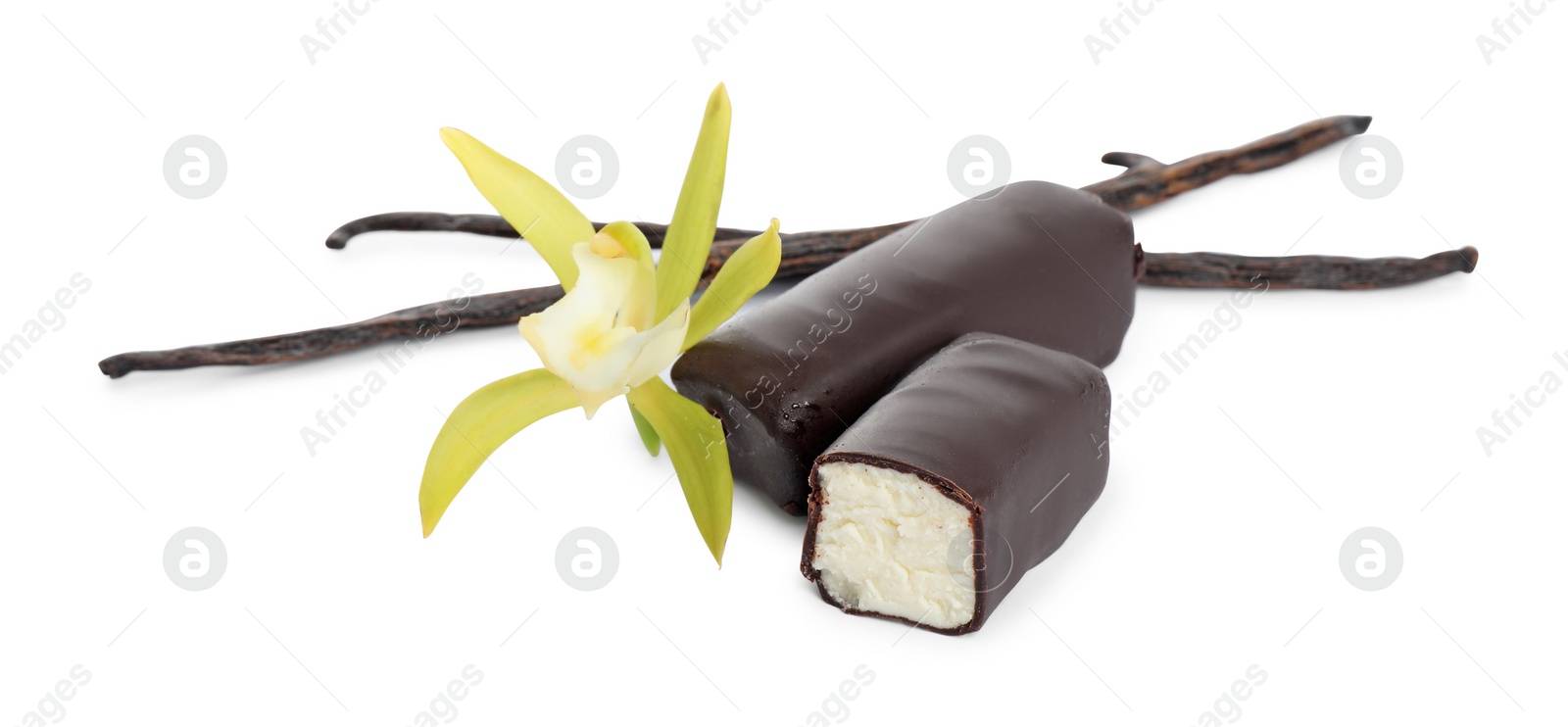 Photo of Glazed curd cheese bars, vanilla pods and flower isolated on white