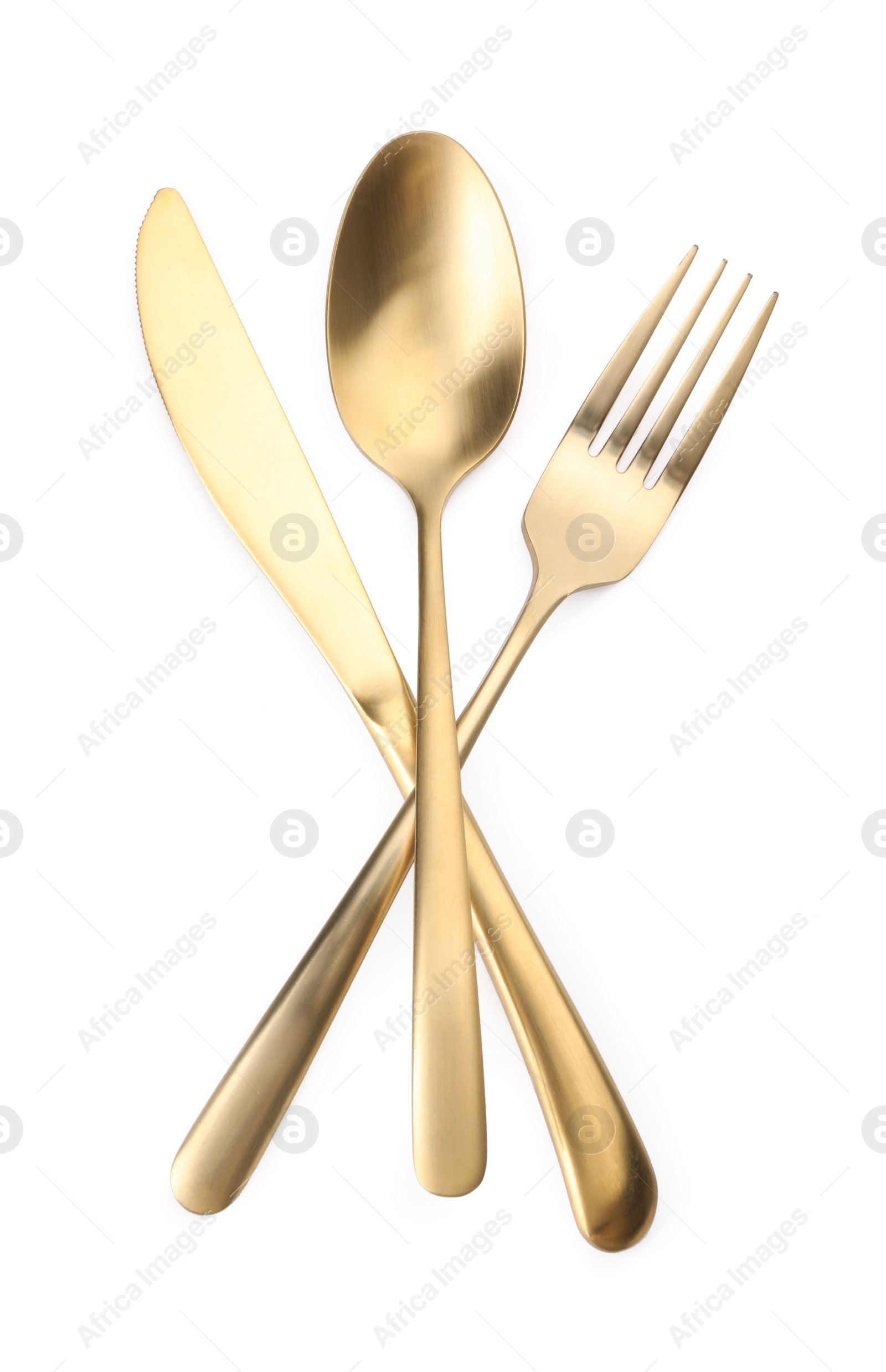 Photo of Shiny golden fork, spoon and knife isolated on white. Luxury cutlery