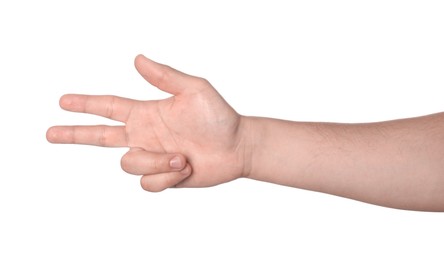 Photo of Playing rock, paper and scissors. Man making scissors with his fingers on white background, closeup