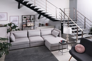 Photo of Stylish living room interior with comfortable sofa