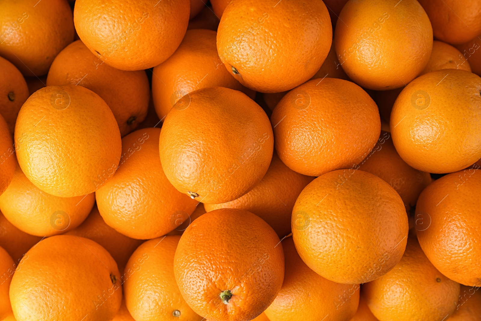 Photo of Pile of fresh ripe oranges as background, top view