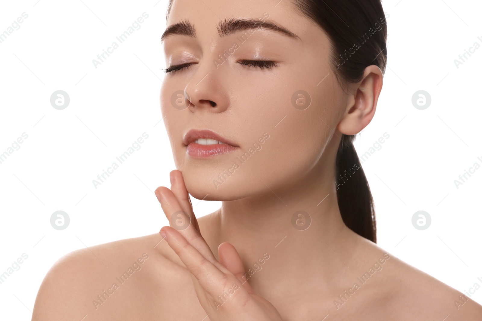 Photo of Young woman massaging her face on white background