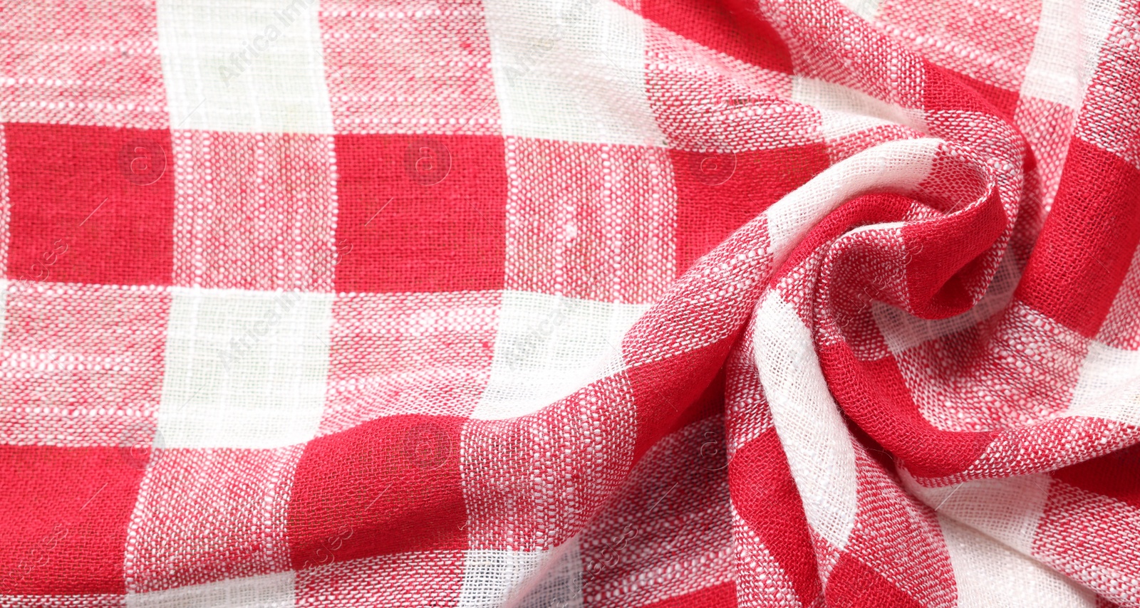 Photo of Texture of crumpled checkered fabric as background, top view