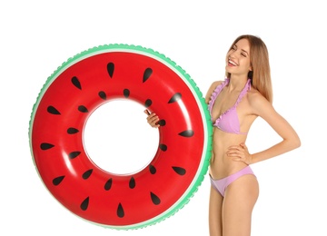 Photo of Beautiful young woman in stylish bikini with watermelon inflatable ring on white background