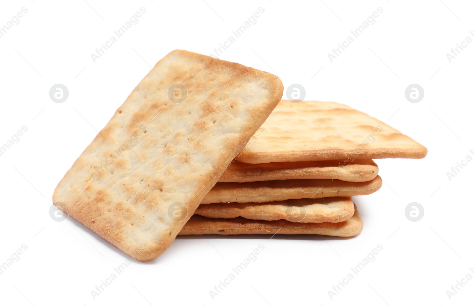 Photo of Tasty crispy square crackers isolated on white