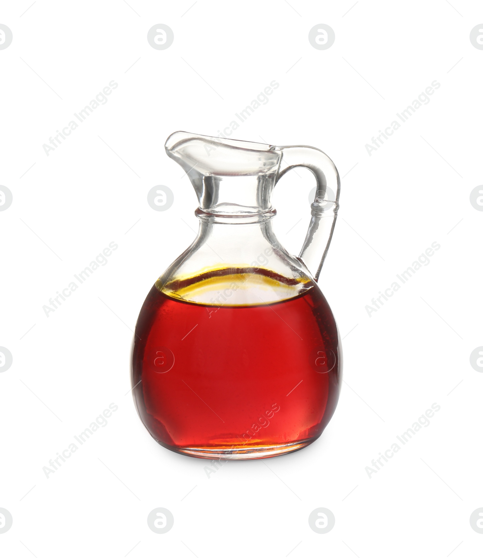 Photo of Palm oil in glass jug isolated on white