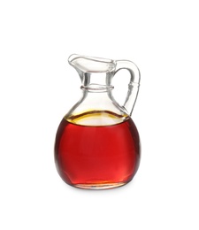 Photo of Palm oil in glass jug isolated on white