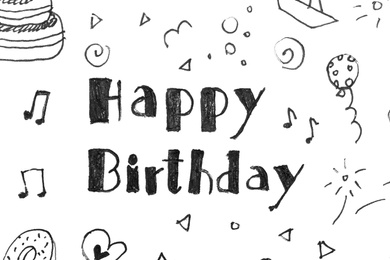 Photo of Words HAPPY BIRTHDAY and funny little pictures on white paper, top view