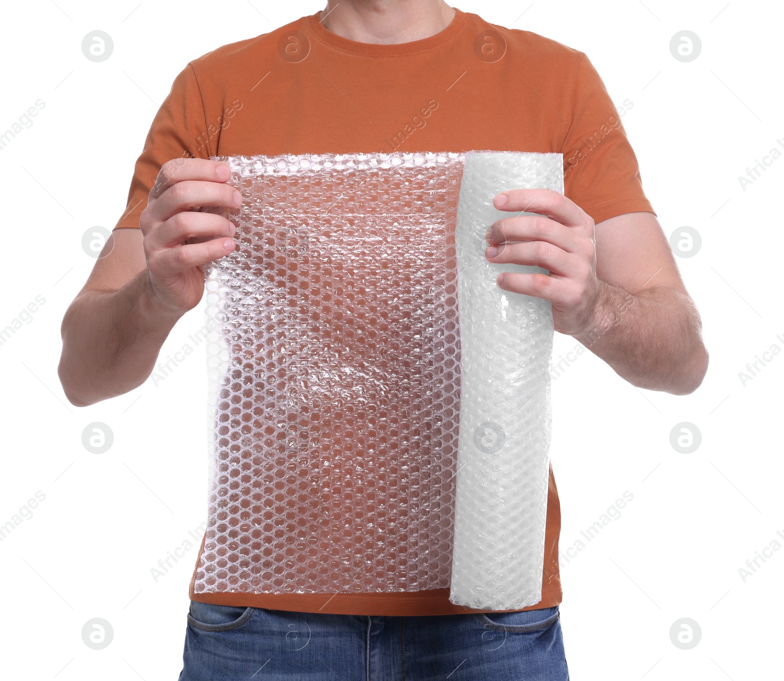 Photo of Man holding roll of bubble wrap on white background, closeup. Stress relief