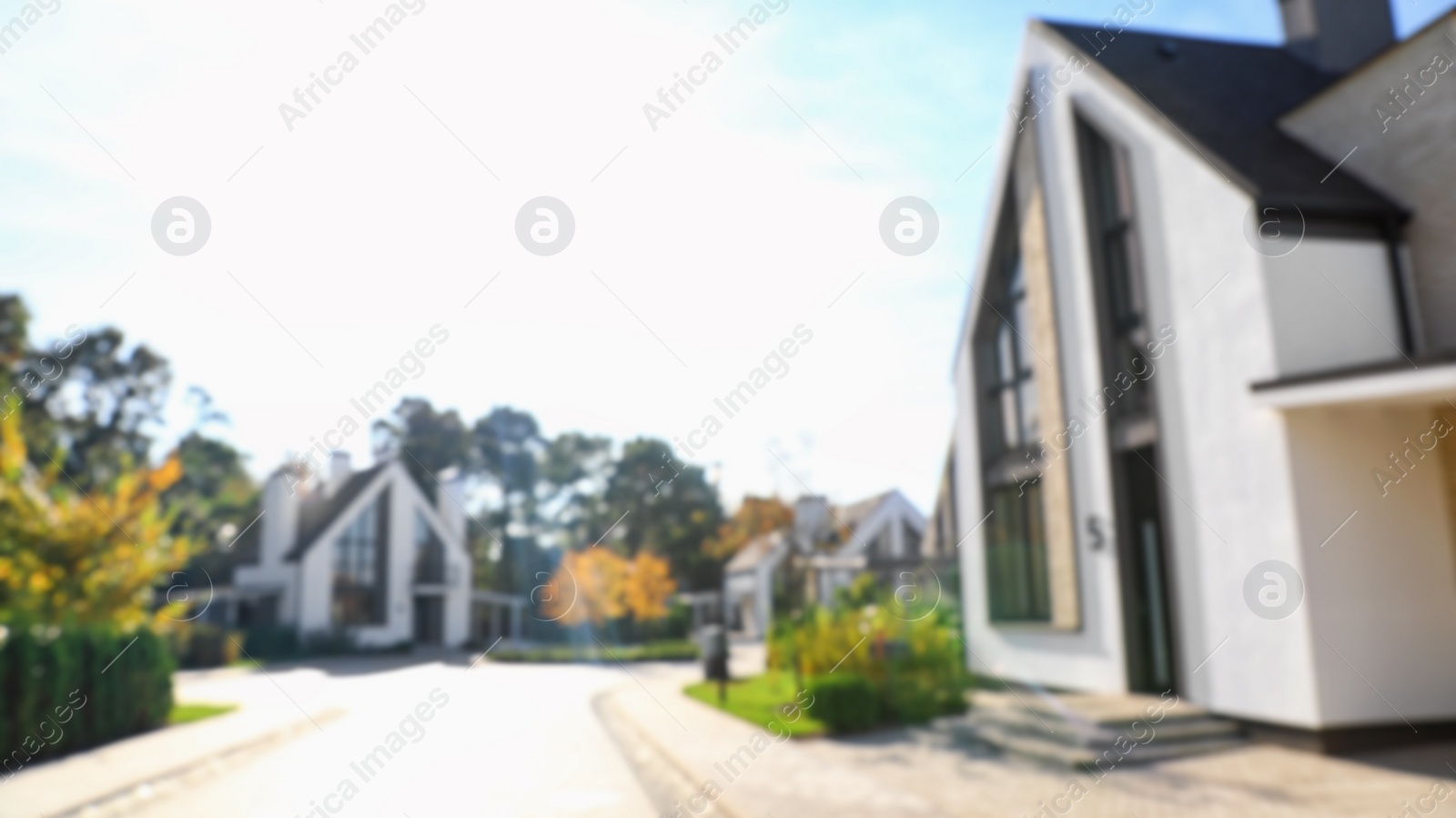 Photo of Landscape with new modern houses on sunny day, blurred view