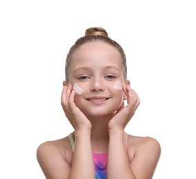 Happy girl applying sun protection cream onto her face isolated on white