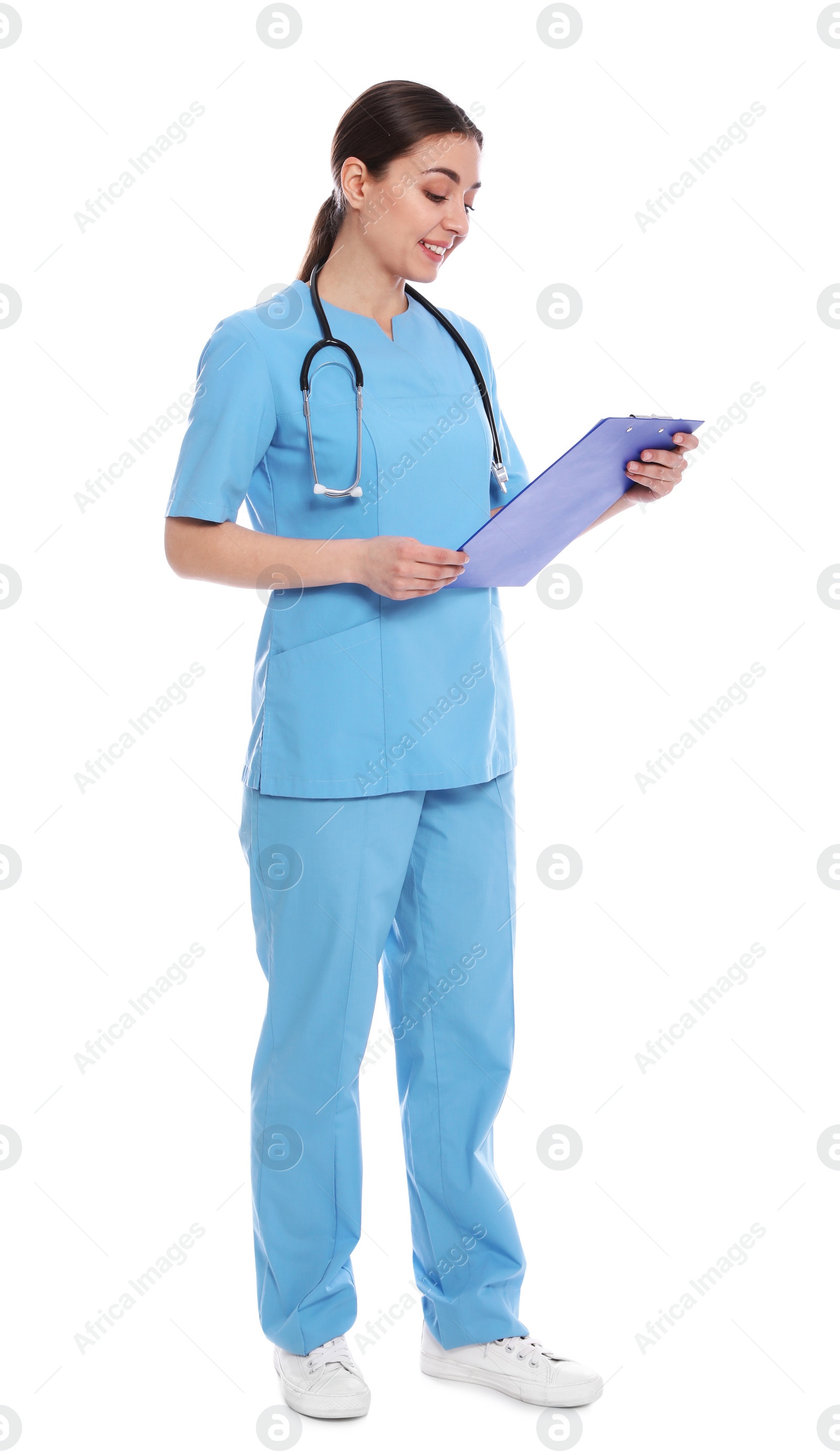 Photo of Full length portrait of medical doctor with clipboard and stethoscope isolated on white