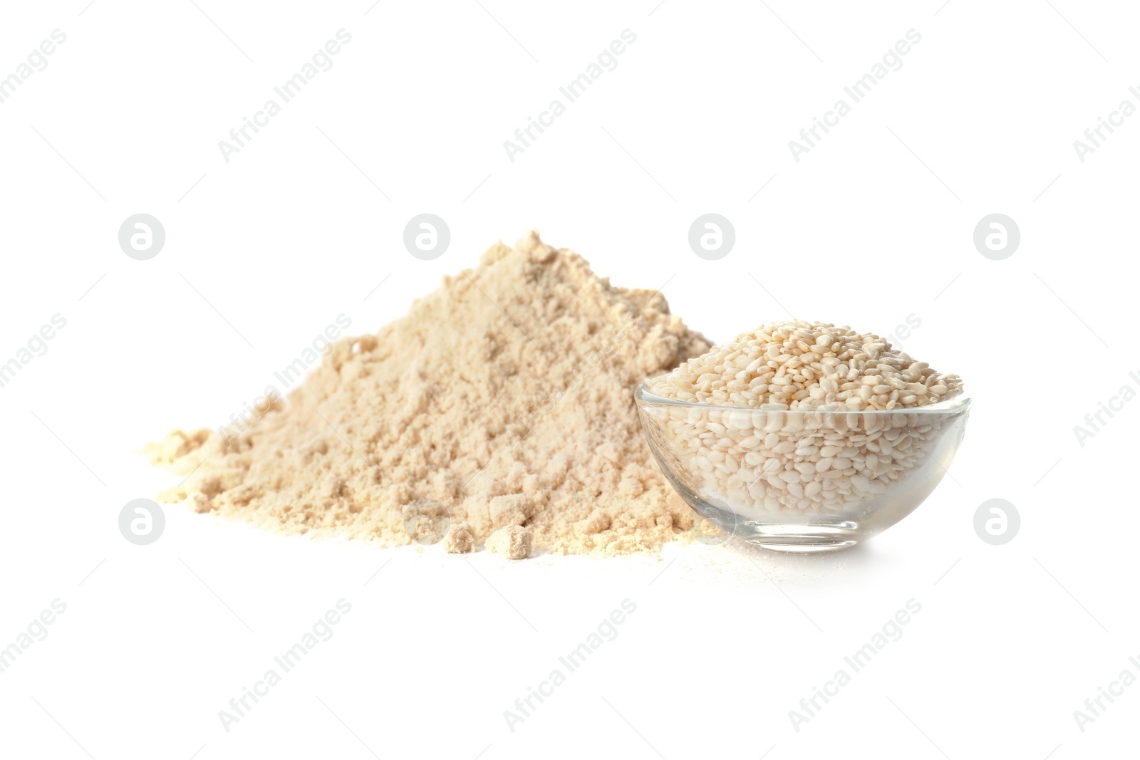 Photo of Pile of fresh flour and bowl with sesame seeds isolated on white