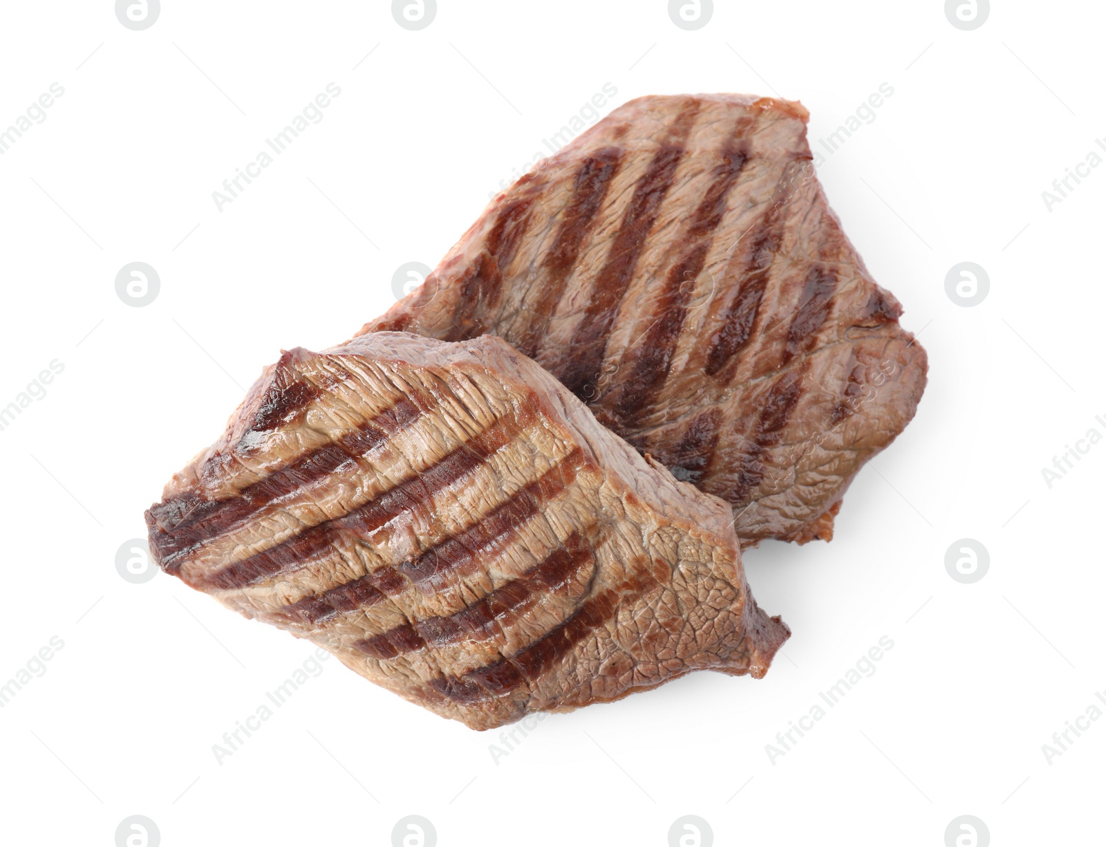 Photo of Delicious grilled beef steaks isolated on white, top view