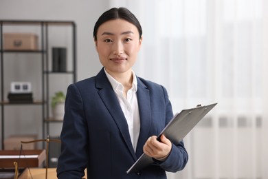 Photo of Portrait of notary with clipboard in office