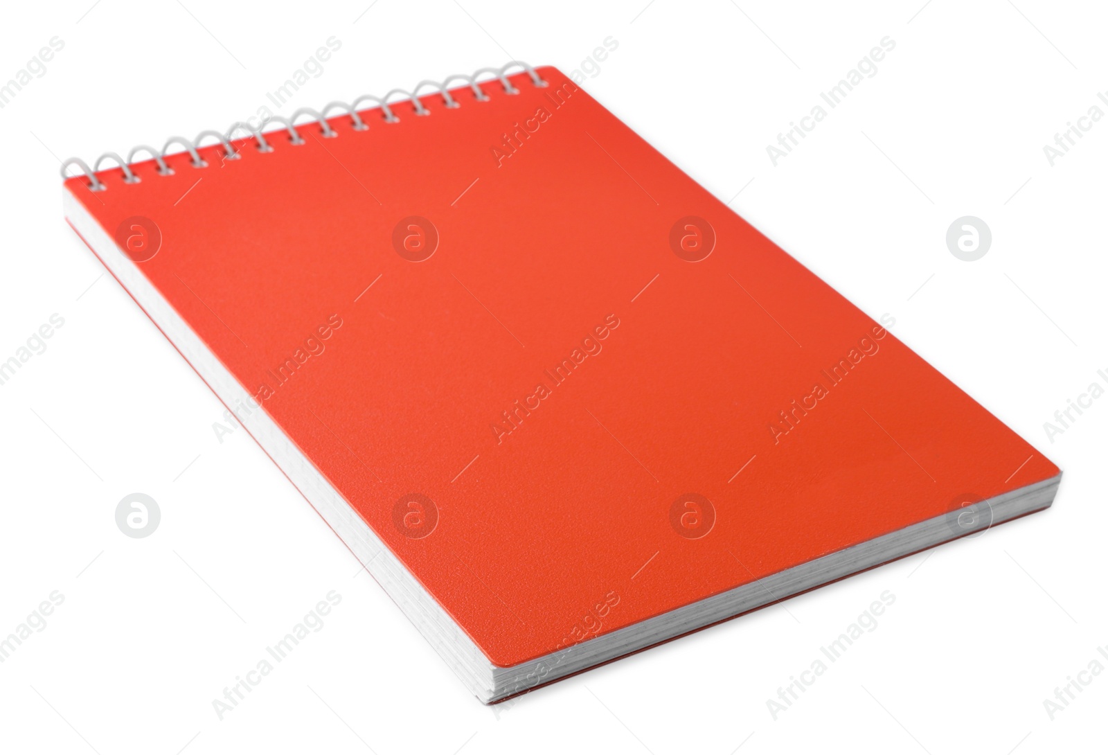 Photo of Stylish orange spiral notebook isolated on white