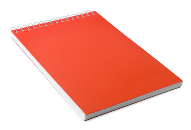 Stylish orange spiral notebook isolated on white