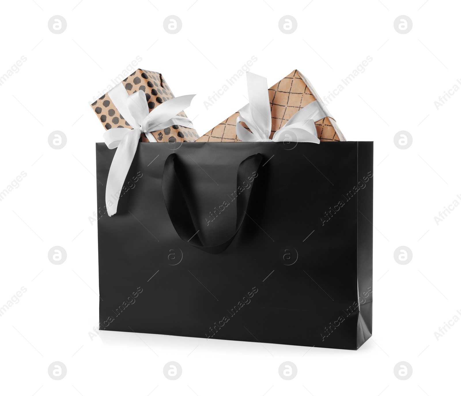 Photo of Paper shopping bag with handles full of gift boxes on white background. Mock up for design