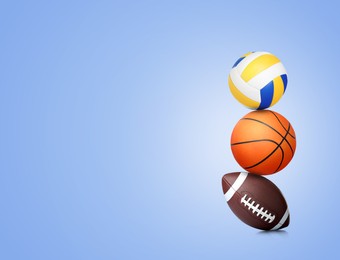 Image of Stack of different sport balls on pale blue background, space for text