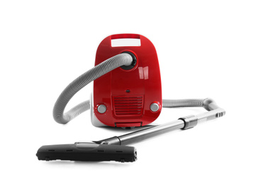 Modern red vacuum cleaner isolated on white