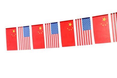 Photo of Garland with USA and China flags on white background. International relations