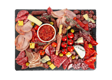 Photo of Slate plate with ham and other delicacies isolated on white, top view