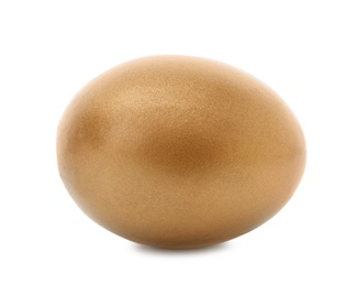Photo of One shiny golden egg on white background