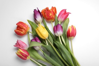Photo of Beautiful colorful tulip flowers on white background, flat lay